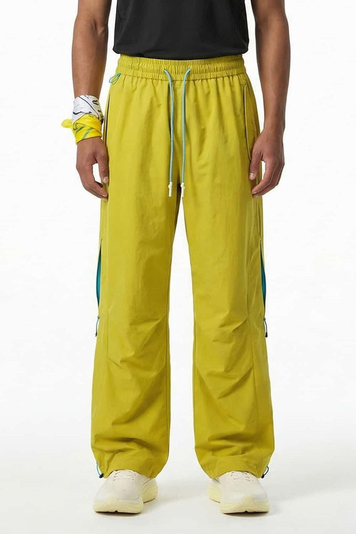 Waterproof Drawstring Trousers with Adjustable Hems in Yellow - front modeled view