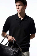 Relaxed Short-Sleeve Knit Polo Shirt in Black - full-length front modeled view