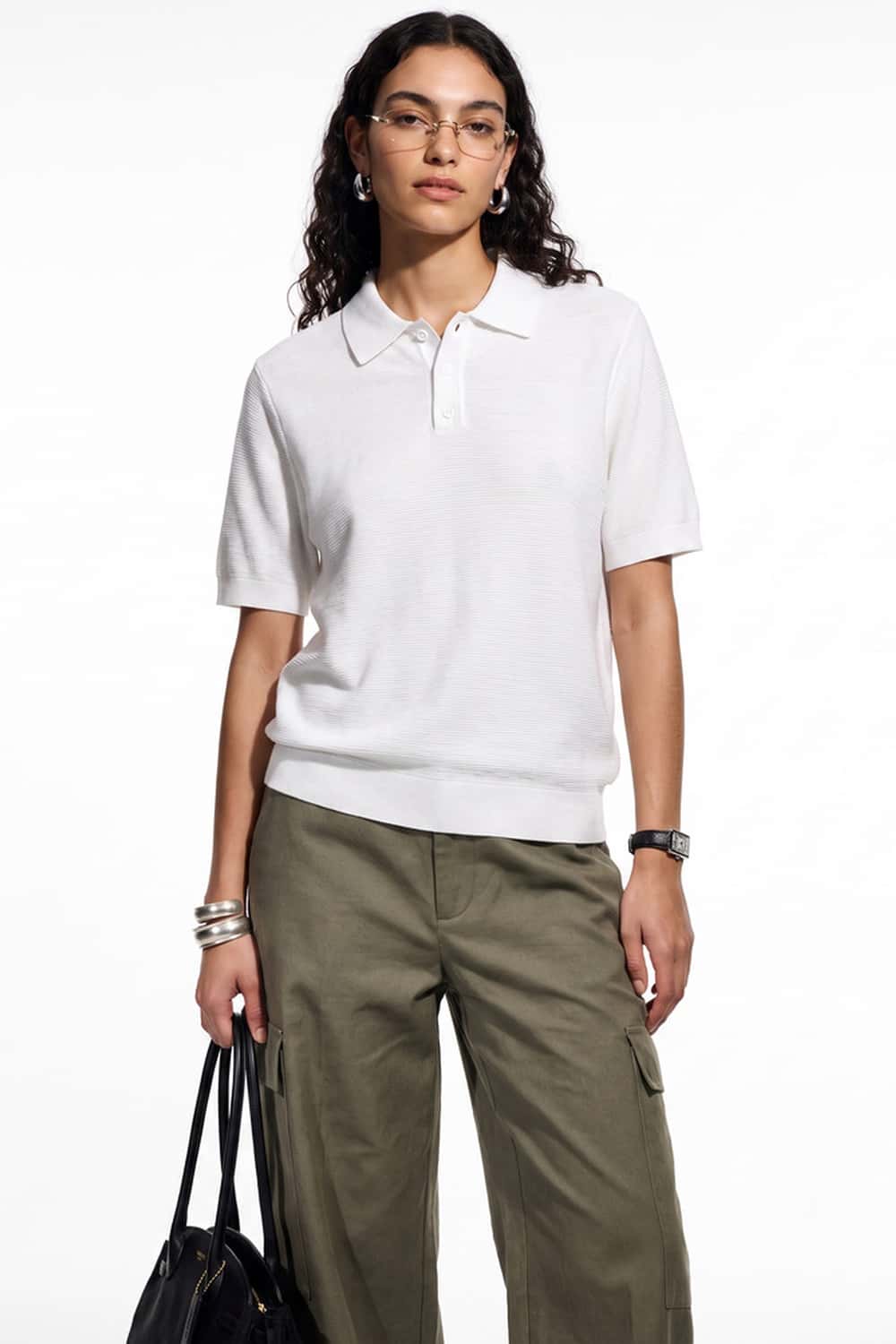 Relaxed Short-Sleeve Knit Polo Shirt in White - three-quarter front modeled view