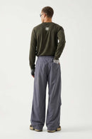 Waterproof Wide-Leg Drawcord Trousers in Dark Gray - full-length back modeled view