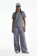 Waterproof Wide-Leg Drawcord Trousers in Light Purple - full-length front modeled view