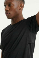 Moisture-Wicking Panelled Performance T-Shirt in Black - three-quarter front modeled view