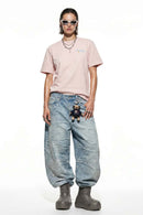 Tennis Club Graphic Cotton-Blend T-Shirt in Pale Pink - full-length front modeled view