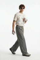 Curved-Trim Wide-Leg Drawcord Pants in Dark Gray - three-quarter front modeled view