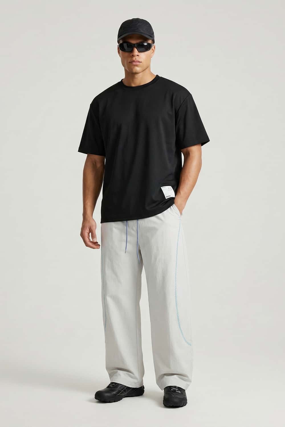 Curved-Trim Wide-Leg Drawcord Pants in Gray - full-length front modeled view