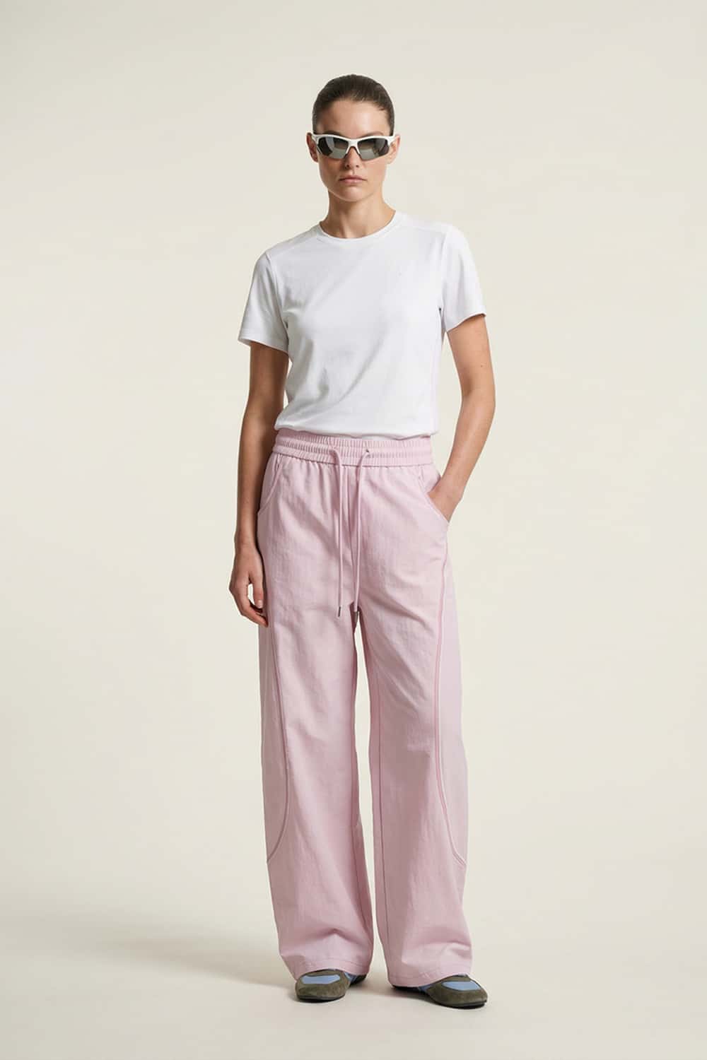 Curved-Trim Wide-Leg Drawcord Pants in Light Pink - full-length front modeled view