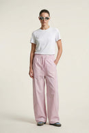 Curved-Trim Wide-Leg Drawcord Pants in Light Pink - full-length front modeled view