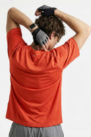 Reflective Perforated Performance T-Shirt in Grayish Orange - back modeled view