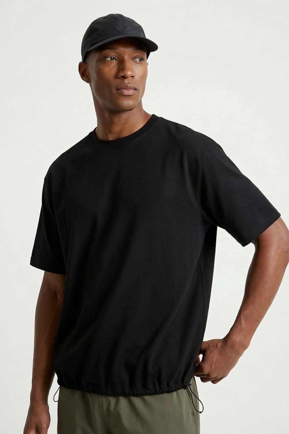 Adjustable-Hem Quick-Drying T-Shirt in Black - three-quarter front modeled view