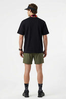 Cool-Touch Panelled T-Shirt in Black - full-length back modeled view