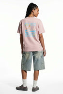 Relaxed Runner Graphic T-Shirt in Pale Pink - full-length back modeled view