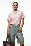 Relaxed Runner Graphic T-Shirt in Pale Pink - front modeled close-up