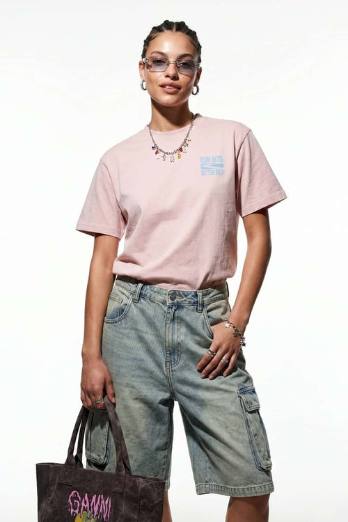 Relaxed Runner Graphic T-Shirt in Pale Pink - front modeled close-up