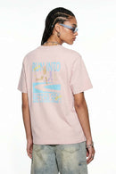 Relaxed Runner Graphic T-Shirt in Pale Pink - back modeled view