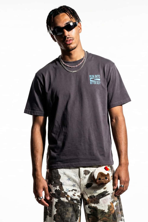 Relaxed Runner Graphic T-Shirt in Plum Purple - front modeled close-up