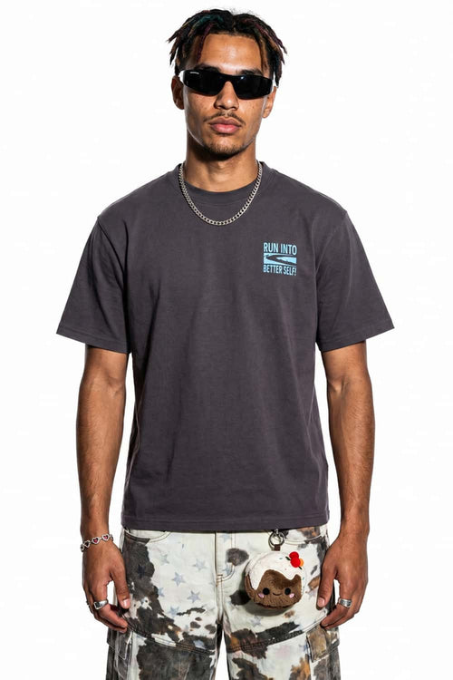 Relaxed Runner Graphic T-Shirt in Plum Purple - front modeled close-up