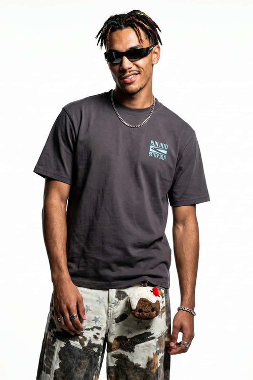Relaxed Runner Graphic T-Shirt in Plum Purple - front modeled close-up