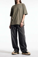 Relaxed Wide-Leg Cotton Trousers in Black - front modeled view