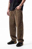 Relaxed Wide-Leg Cotton Trousers in Coffee - three-quarter front modeled view