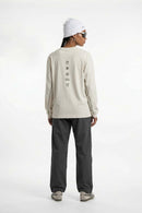 Exposed-Stitch Cotton Long-Sleeve Top in Apricot - full-length back modeled view