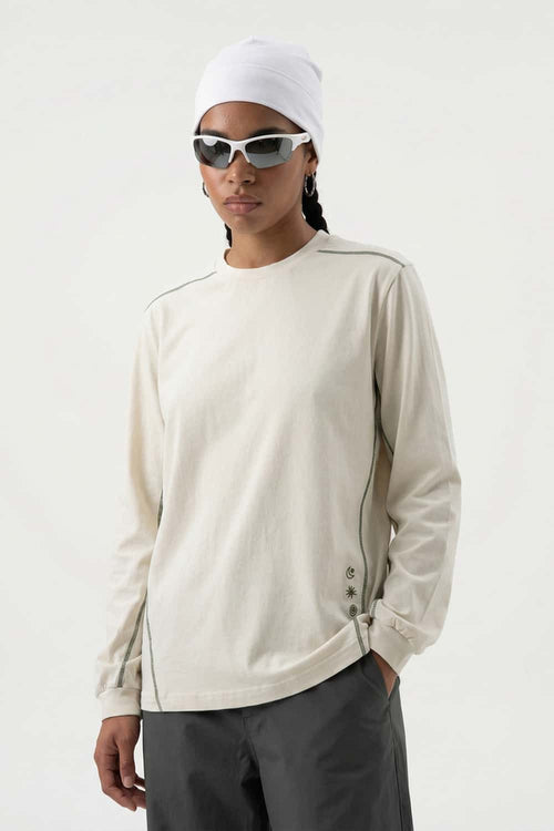Exposed-Stitch Cotton Long-Sleeve Top in Apricot - front modeled view
