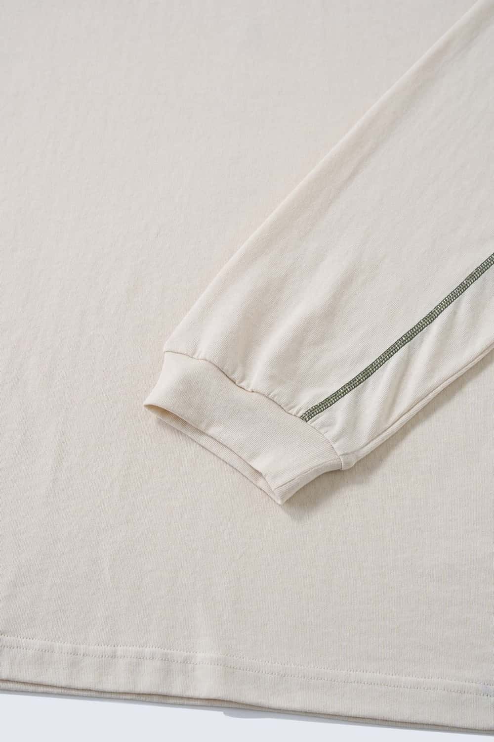 Exposed-Stitch Cotton Long-Sleeve Top in Apricot - cuff detail