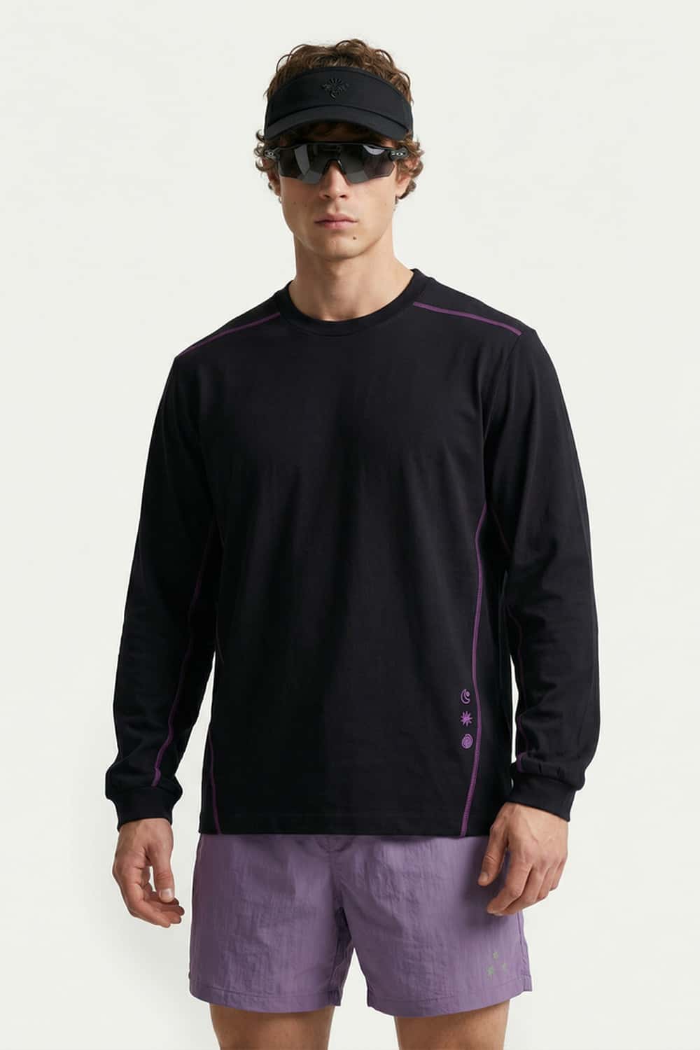 Exposed-Stitch Cotton Long-Sleeve Top in Black - three-quarter front modeled view