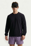 Exposed-Stitch Cotton Long-Sleeve Top in Black - three-quarter front modeled view