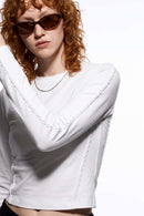 Women's High-Stretch Loop-Trim Fitted Top in White - three-quarter front modeled view
