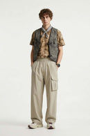 Adjustable-Hem Wide-Leg Cargo Pants in Khaki - full-length front modeled view