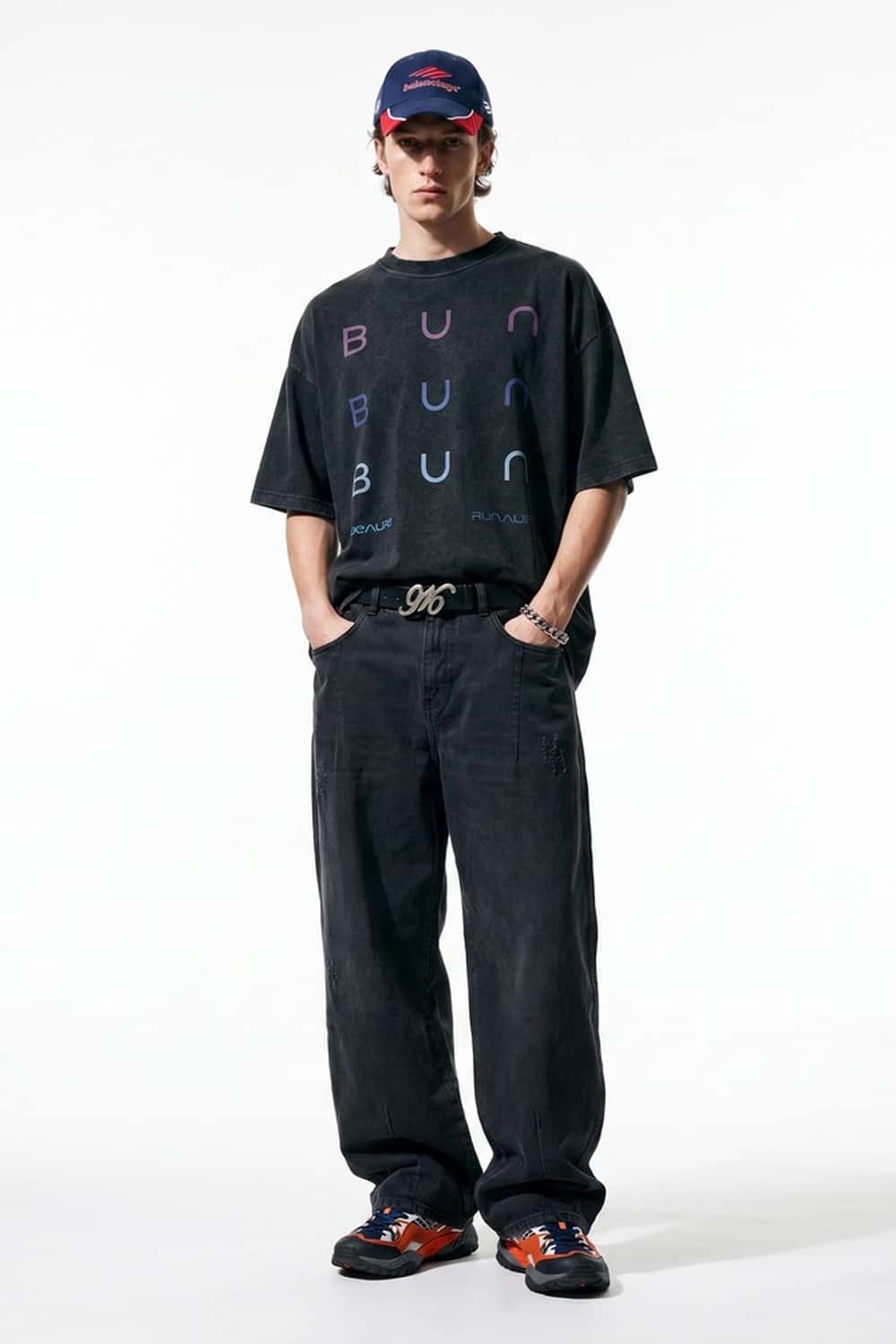 Curved-Leg Washed Cotton Pants in Black - full-length front modeled view