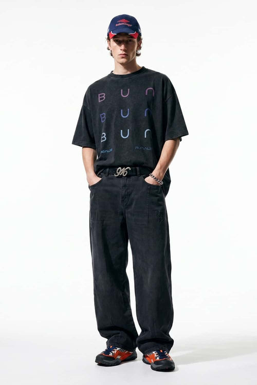 Curved-Leg Washed Cotton Pants in Black - full-length front modeled view