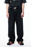 Curved-Leg Washed Cotton Pants in Black - front modeled view