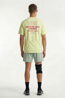 Trail-Running T-Shirt with Back Storage in Fluorescent Green - full-length back modeled view