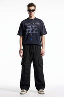 Drawstring Wide-Leg Cargo Trousers in Black - full-length front modeled view