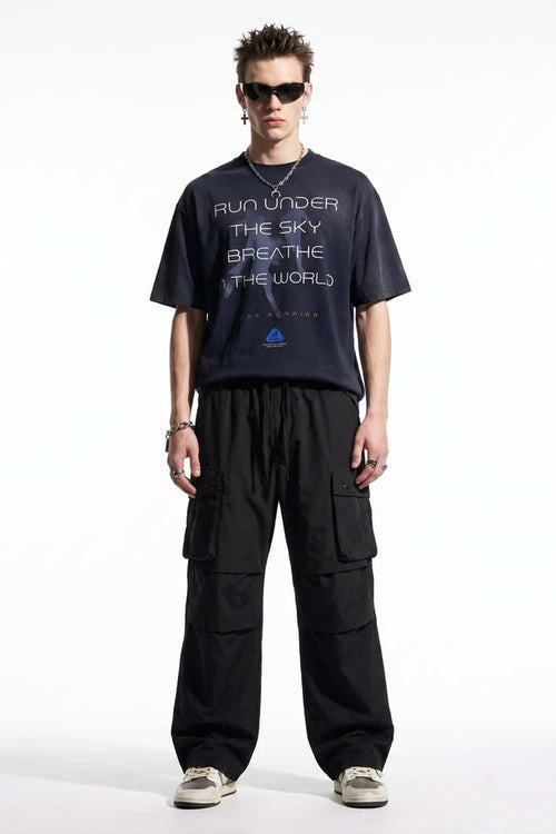 Drawstring Wide-Leg Cargo Trousers in Black - full-length front modeled view