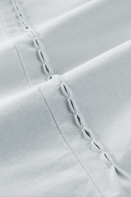 High-Stretch Loop-Trim Long-Sleeve T-Shirt in Grayish White - decorative detail