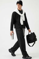 Waffle-Texture Long-Sleeve Top in Black - three-quarter front modeled view
