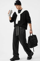 Waffle-Texture Long-Sleeve Top in Black - full-length front modeled view