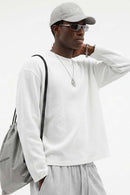 Waffle-Texture Long-Sleeve Top in White - three-quarter front modeled view