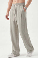 Heavyweight Wide-Leg Trousers in Oat Gray - three-quarter front modeled view