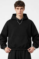 Fleece-Lined Boxy Pullover Hoodie in Black - front modeled view