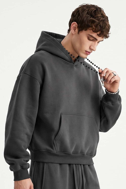 Fleece-Lined Boxy Pullover Hoodie in Dark Gray - three-quarter front modeled view