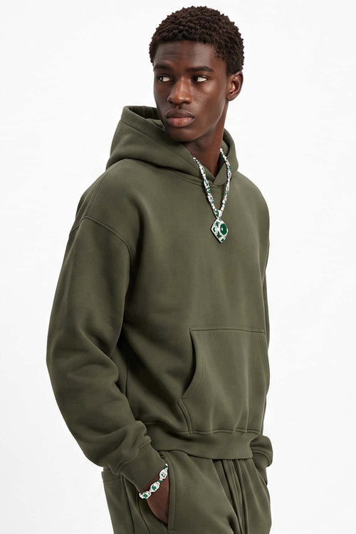 Fleece-Lined Boxy Pullover Hoodie in Military Green - three-quarter front modeled view
