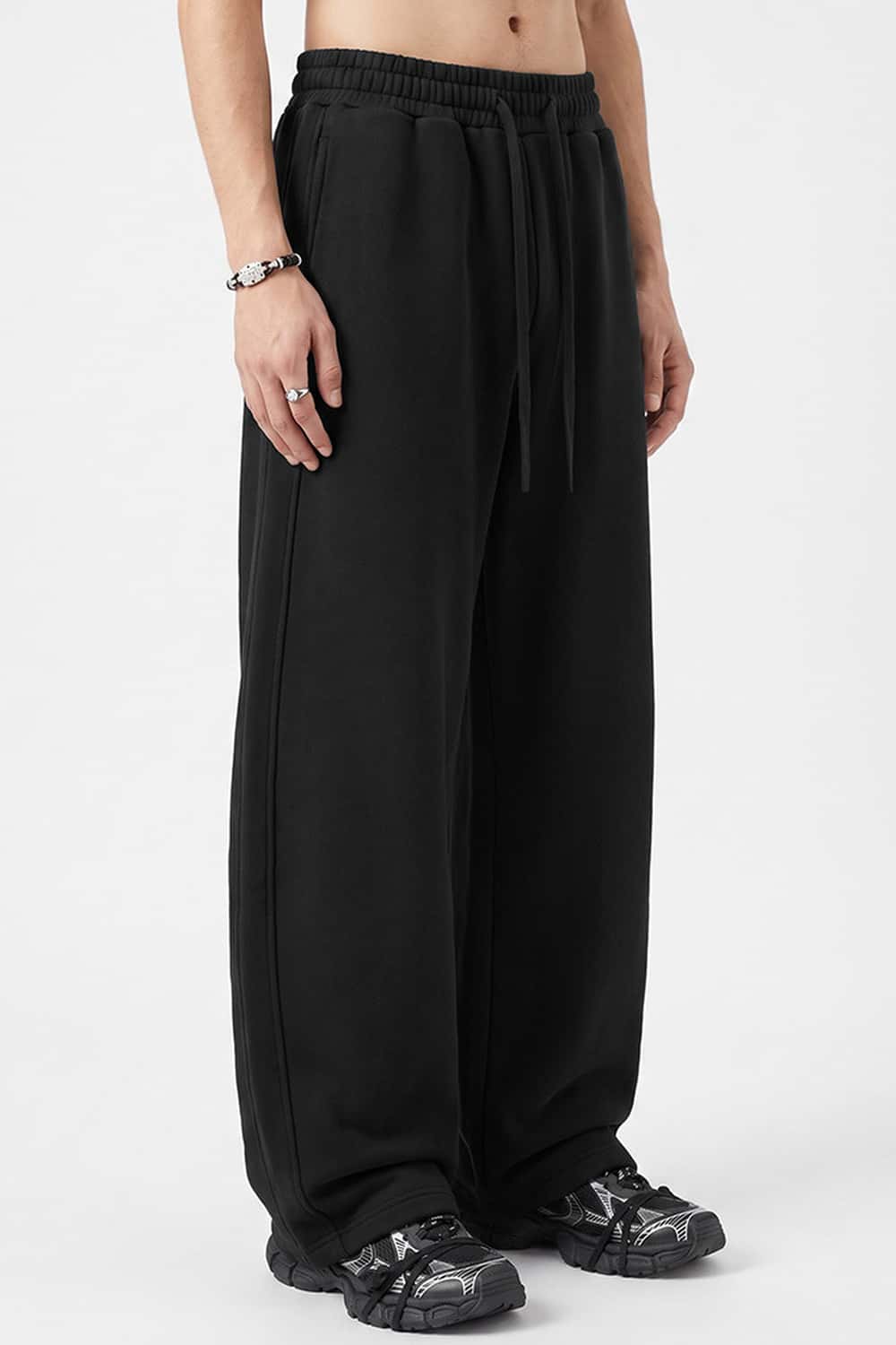 Fleece-Lined Wide-Leg Drawstring Trousers in Black - front modeled view
