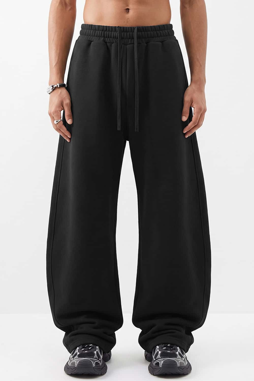 Fleece-Lined Wide-Leg Drawstring Trousers in Black - full-length front modeled view