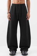 Fleece-Lined Wide-Leg Drawstring Trousers in Black - full-length front modeled view
