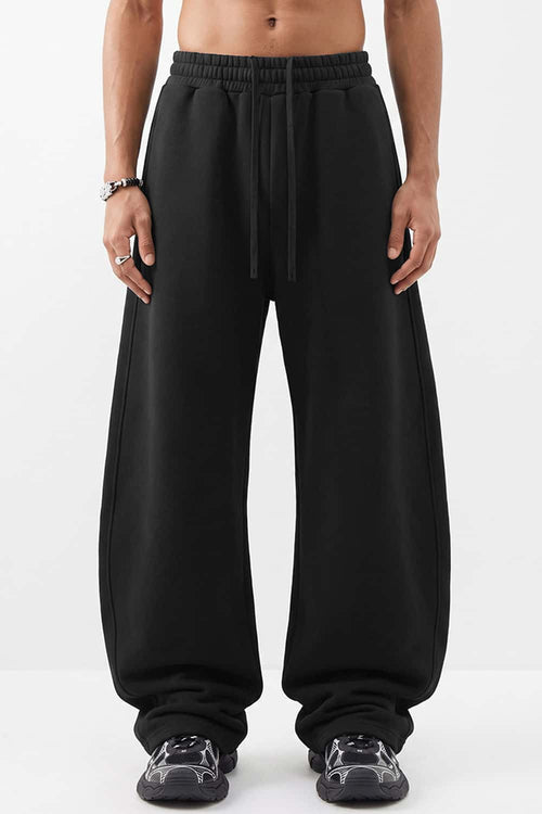 Fleece-Lined Wide-Leg Drawstring Trousers in Black - full-length front modeled view