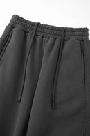 Fleece-Lined Wide-Leg Drawstring Trousers in Dark Gray - waistband and pocket detail