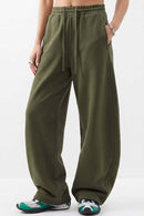 Fleece-Lined Wide-Leg Drawstring Trousers in Military Green - full-length front modeled view